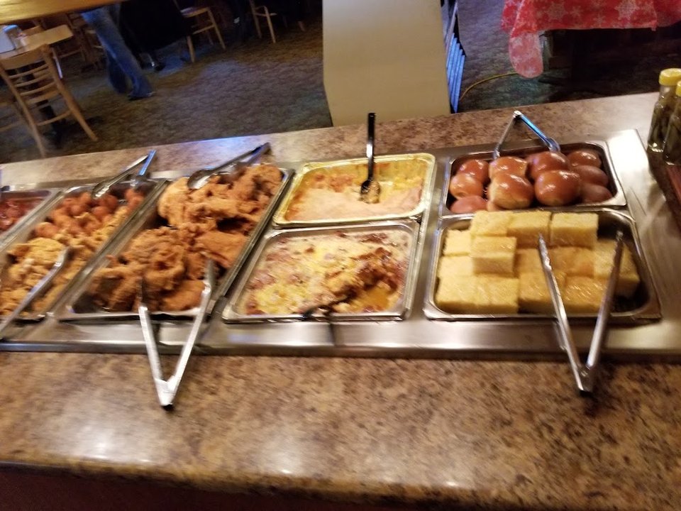 Menu board with dinners, desserts, and drinks.